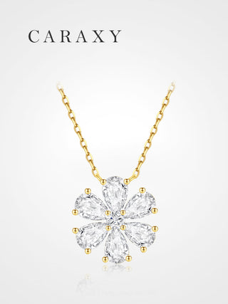 Diamond flower pendant necklace in 18K yellow gold with pear-shaped stones arranged as petals in a dainty floral cluster design.