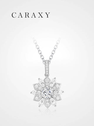 Diamond snowflake pendant necklace with a round center stone and sparkling white gold details.