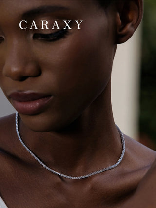 Model wearing a lab grown diamond tennis choker necklace in 18K white gold.