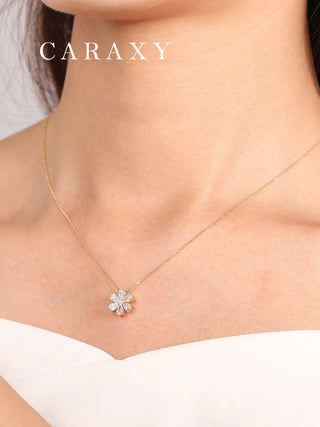 Model wearing an elegant flower shaped lab grown diamond necklace in 18k yellow gold.