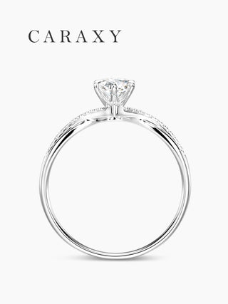 Side view of elevated twist pavé diamond engagement ring with low profile setting.