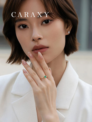 Emerald birthstone ring styled for everyday wear.