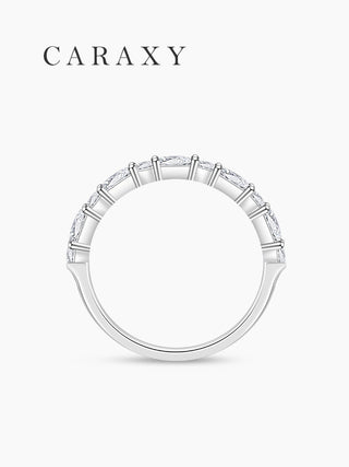 Side view of emerald-cut and round diamond band.