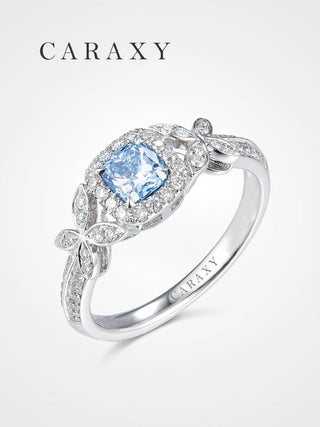 Perspective studio shot highlighting the shimmering pavé band and the diamond-set butterfly wings on the 1ct blue diamond ring.