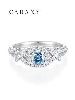 Top view of the 1 carat cushion cut fancy intense blue diamond with a square halo and butterfly wing accents.