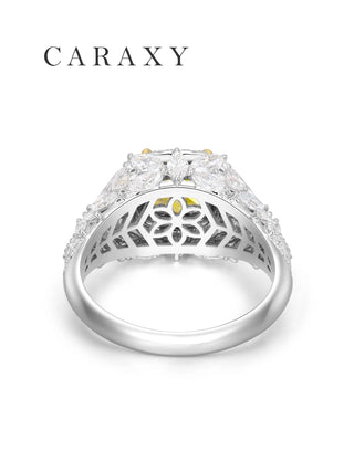 Bottom view of a fancy yellow diamond ring with double halo and marquise diamond accents and hollow-carved design.