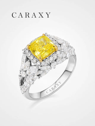A luxurious fancy yellow diamond statement ring with a marquise diamond band.
