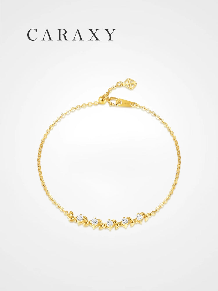 Five-stone lab grown diamond bracelet in 18K yellow gold with round diamonds and leaf-inspired accents.