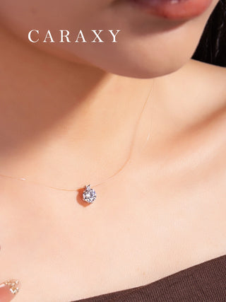 Floating lab grown diamond necklace on model with invisible clear line chain and minimalist diamond pendant.