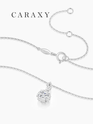 Close-up of a floral diamond necklace with an adjustable cable chain and spring ring clasp.