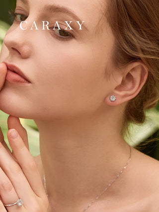 Model wearing floral diamond studs in an elegant lifestyle view.