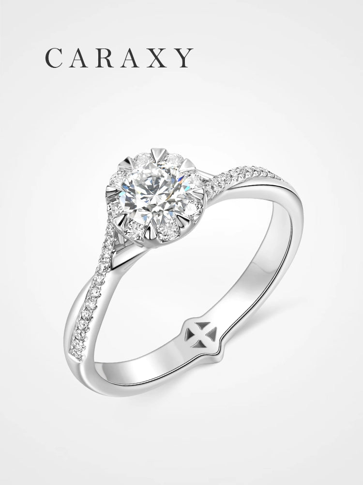 A stunning floral engagement ring with a cluster diamond setting and pavé band.