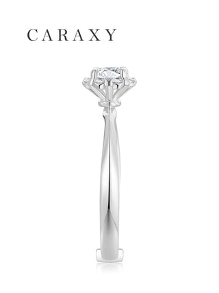 Side profile of a floral engagement ring with high profile setting and tapered band.