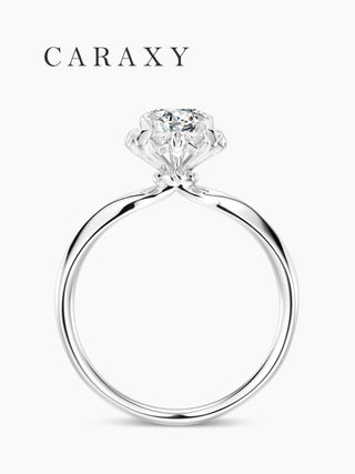 side profile of a floral engagement ring with high profile setting and tapered band