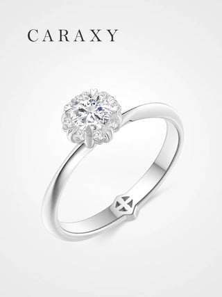 Floral halo lab grown diamond engagement ring in 18k white gold caraxy.