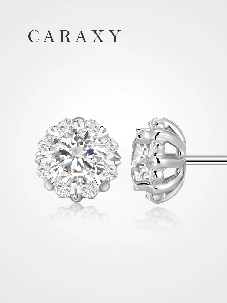 Floral halo lab grown diamond stud earrings with round center diamonds and petal-like accents.