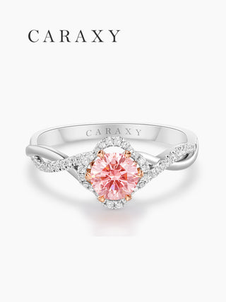 Top view of a lab-grown pink diamond ring with a shimmering floral-inspired halo.