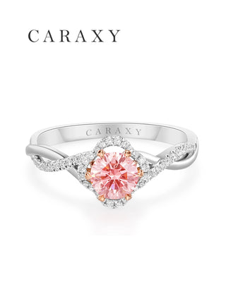 Top view of a lab-grown pink diamond ring with a shimmering floral-inspired halo.