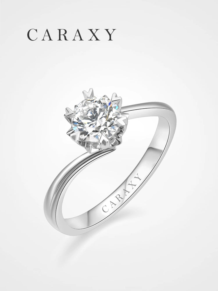 Floral-inspired lab-grown diamond solitaire engagement ring with a bypass shank.