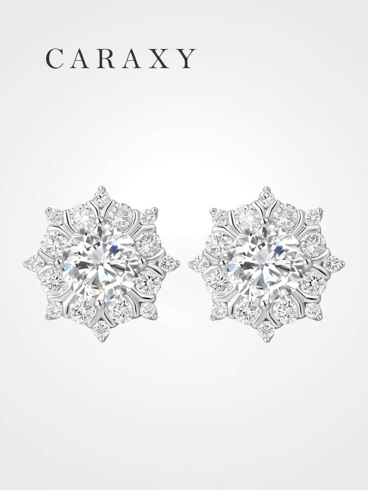 Floral snowflake lab grown diamond stud earrings shown in a front product view.