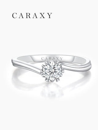 Top view of a lab-grown diamond solitaire ring with an elegant floral-inspired design.