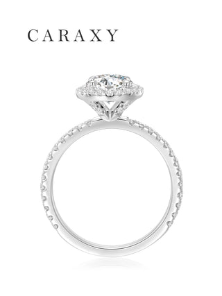 Side view of halo engagement ring showcasing the elegant open gallery and 18K white gold setting.