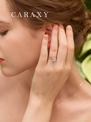 close-up of high profile setting engagement ring worn on lady's hand