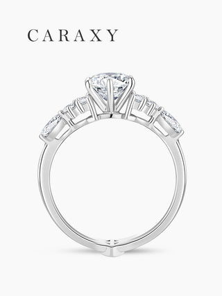 Side profile of a high-set round lab-grown diamond engagement ring with floral accent stones