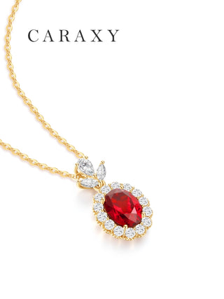 July birthstone lab created ruby diamond halo necklace with diamond accents in 18K yellow gold.