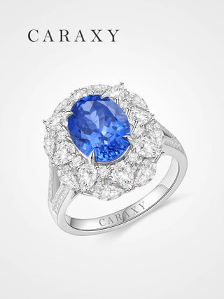 Lab created blue sapphire cocktail ring in 18K white gold.