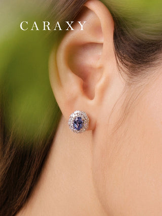 Model wearing lab created blue sapphire and diamond stud earrings in 18K white gold, ideal for bridal jewelry, anniversaries, and special occasions.