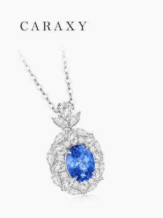 Lab created cornflower blue sapphire necklace with pear and marquise lab grown diamond floral halo.