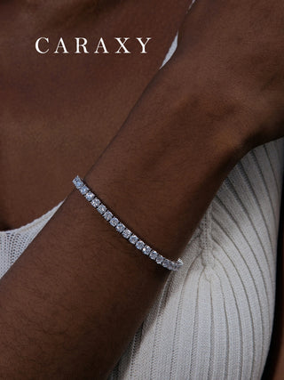 Model wearing a lab created diamond tennis bracelet in 18K white gold.