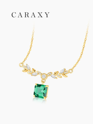 Lab created emerald leaf necklace in 18K yellow gold with marquise and round lab grown diamond accents.