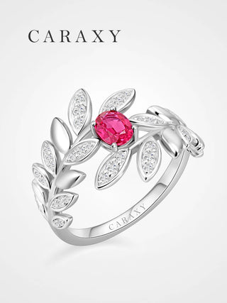 Lab created ruby botanical statement ring with micro pavé diamond leaves and polished metal leaf details.