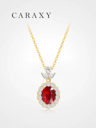 Lab created ruby diamond halo necklace in 18K yellow gold with oval ruby center stone