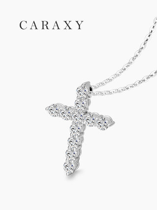 Close-up of a dainty lab grown diamond cross necklace in 18K white gold with round brilliant diamonds.