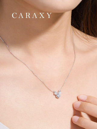 Close-up shot of the reindeer pendant on a model, emphasizing the diamond brilliance.