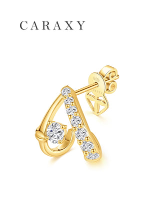 Angled view of lab grown diamond open huggie earrings in 18K yellow gold with pavé diamond accents.