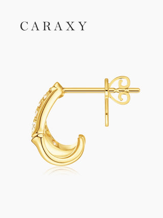 Side view of lab grown diamond open huggie earrings in 18K yellow gold with butterfly push back.