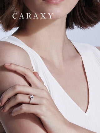 Lab-grown diamond engagement ring worn on hand with elegant floral styling