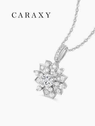 Angled view of a lab grown diamond snowflake necklace in 18K white gold with a round center stone and brilliant diamond accents.