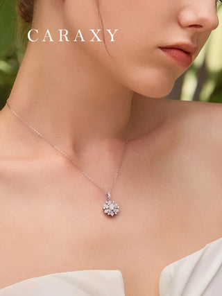 Model wearing a lab grown diamond snowflake necklace in 18K white gold with a delicate winter-inspired look.