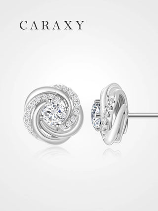 Lab grown diamond swirl stud earrings in 18K white gold shown from front and side.