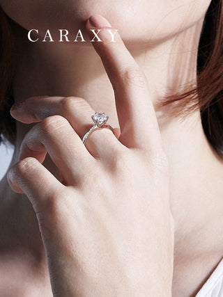 Lifestyle view of a model wearing a CARAXY lab-grown engagement ring.