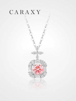 Full view of a lab-grown fancy pink diamond halo pendant necklace in 18K white gold with rose gold tone prongs and a cable chain.