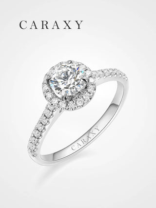 Classic lab-grown halo engagement ring with a brilliant round center and pavé band.