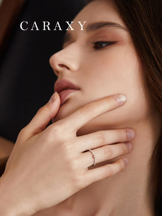 Woman wearing a lab grown pink diamond ring with a delicate two-tone design