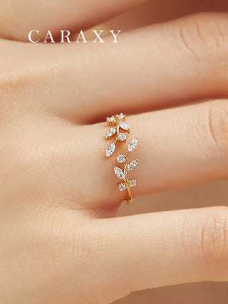 Close-up of a leaf and vine lab grown diamond open wedding band in 18K yellow gold