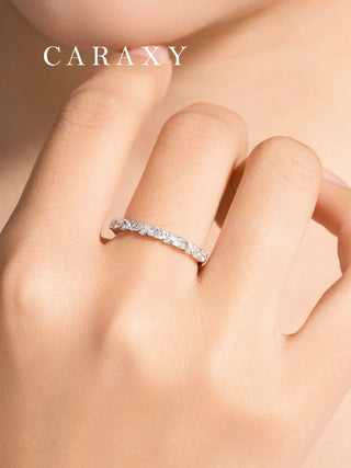 Woman wearing a leaf lab grown diamond half eternity wedding band in 18K white gold